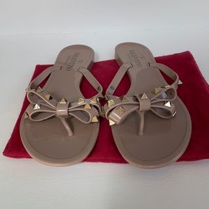 Valentino Garavani Rockstud Bow Jelly Sandals.